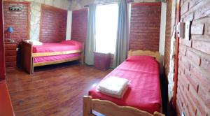 Postel nebo postele na pokoji v ubytování Cerros Azules