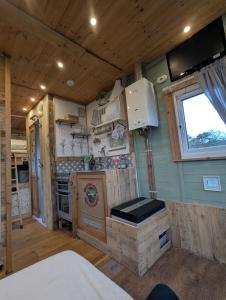 an interior view of a kitchen in an rv at The Horsebox at Wits End in Hartford