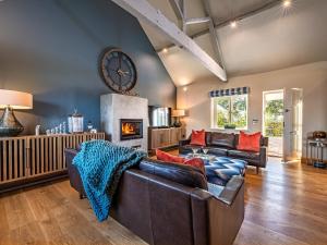 a living room with a couch and a fireplace at 3 Bed in Madley 83659 in Madley
