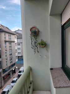 En balkon eller terrasse på Apartamento Puerta de San Fernando