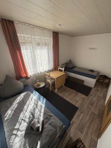 Postel nebo postele na pokoji v ubytování Ferienhaus WorkersParadise