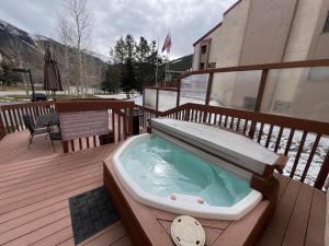 a hot tub on the deck of a building at Summit House East 1 Bed Loft 2 Bath SHMB in Wheeler Junction