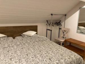 a bedroom with a bed and a table at B&B Haus Jola in Nidrum