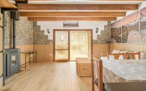 a bedroom with a bed in a room with a window at Casa Los Altos de Santiago in Villanúa