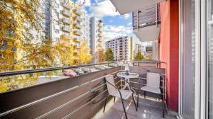 a balcony with a table and chairs on a building at RT Luxury Royal Residence in Braşov