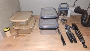a table with two plastic containers on top of a desk at Roots of Grace in Polokwane