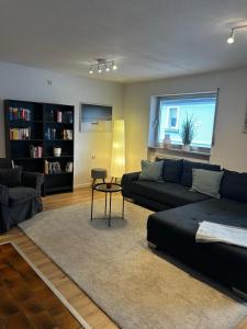 a living room with a couch and a table at Apartment Sansibar in Bann