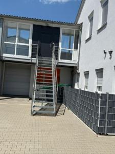 a house with a ladder in front of a house at Panorama-180-Grad in Kitzingen