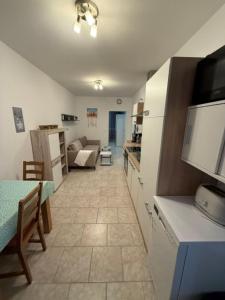 a kitchen and living room with a couch and a table at Panorama-180-Grad in Kitzingen