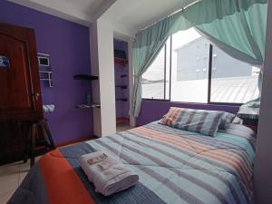 Giường trong phòng chung tại Centro Macas