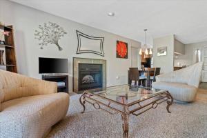 a living room with a coffee table and a fireplace at Kaibab - Adobe Village condo - 2 bedroom in Oak Creek
