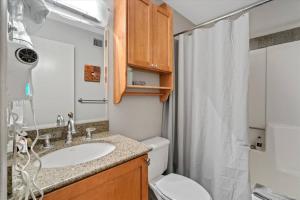 a bathroom with a sink and a toilet and a shower at Kaibab - Adobe Village condo - 2 bedroom in Oak Creek +25 photos