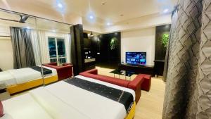 Ένα ή περισσότερα κρεβάτια σε δωμάτιο στο Hotel The Grace Residency ,DLF, Gomti Nagar Lucknow