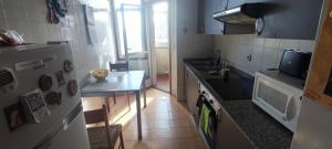Η κουζίνα ή μικρή κουζίνα στο Loureiro Rooms