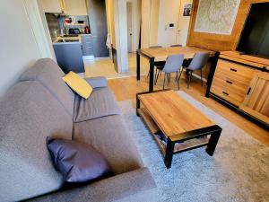 a living room with a couch and a table at Appartement moderne 3 pièces aux Arcs 1800 - FR-1-346-537 in Arc 1800