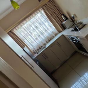 an overhead view of a kitchen with a window at Sydney's NA Guest House and Venue in Isipingo +27 photos