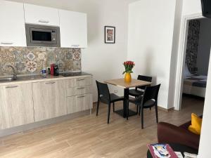 Kuchyň nebo kuchyňský kout v ubytování Casa Memi