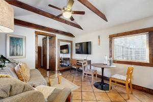 a living room with a couch and a table at Main Street Wood Cottage in Brevard
