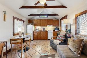 a living room with a couch and a table at Main Street Wood Cottage in Brevard