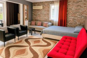 a bedroom with a bed and a living room at Luxury and Comfort in Central Alsancak Perfect for Groups or Families in Izmir +10 photos