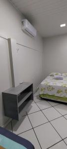 Postel nebo postele na pokoji v ubytování Casa, ótima localização, fantástica