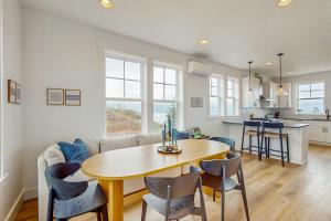 a dining room and kitchen with a table and chairs at Pacific Perch in Depoe Bay +18 photos