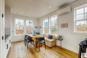 a living room with a table and a couch at Pacific Perch in Depoe Bay