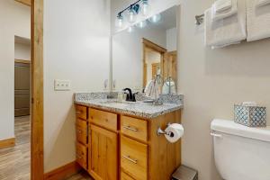a bathroom with a sink and a toilet at Rocky Crest Retreat in Somers +14 photos