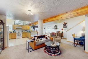 a living room with a couch and a table at Saddle Peak Outpost- Unit A & B in Belgrade