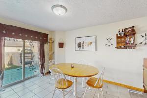 a dining room with a table and chairs at Saddle Peak Outpost- Unit A & B in Belgrade