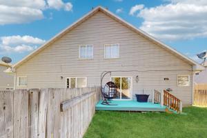 a house with a wooden fence in front of it at Saddle Peak Outpost- Unit A & B in Belgrade