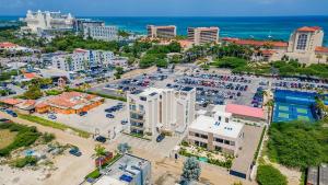 an aerial view of a city with a parking lot at Modern Studio w/ Pool, Gym & Rooftop Palm Beach in Palm-Eagle Beach