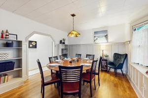 a dining room with a table and chairs at Summit Lookout Bungalow in South Bend +27 photos