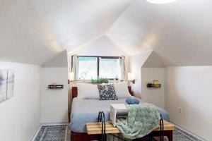a bedroom with a bed and a window at Summit Lookout Bungalow in South Bend