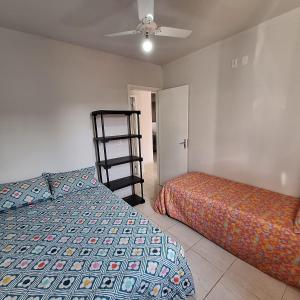 a bedroom with a bed and a ladder in it at bairro Jardim Parati - casa 2 quartos em condomínio in Campo Grande