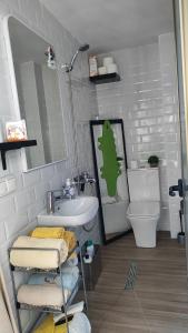 a bathroom with a sink and a toilet at La casa del patio in Ágreda +23 photos