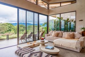 a living room with a couch and a table at Casa Oasis in San Luis