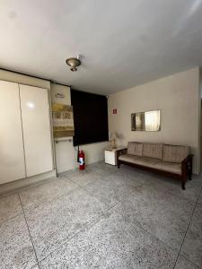 a living room with a couch and a blackboard at Modern Apartment in São Caetano do Sul in São Caetano do Sul