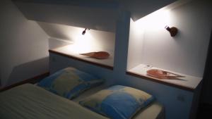 Postel nebo postele na pokoji v ubytování Maison de la Libération 6 Juin 1944 OMAHA BEACH