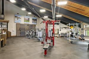 a gym with a lot of equipment in a room at Million Dollar View- 419 in Rockwood