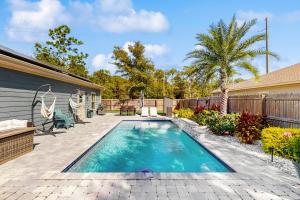 a swimming pool in the backyard of a house at Blue Pearl in Navarre