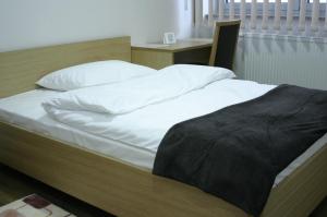 Postel nebo postele na pokoji v ubytování Rooms Virovitica