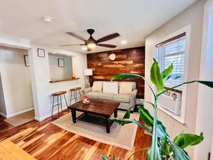 a living room with a couch and a table at Ultra Modern - Entire 3 Bedroom Apartment - 5 min walk to the Beach in Wildwood