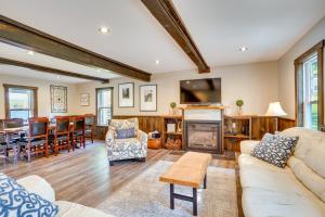 a living room with a fireplace and a dining room at half Mi to Song Mountain Resort Ski Getaway! in Tully