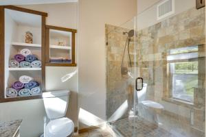 a bathroom with a glass shower stall and a toilet at half Mi to Song Mountain Resort Ski Getaway! in Tully +35 photos