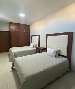 a hotel room with two beds at Casa Madre Perla - a 2 min de la Playa Miramar in Colonia Miramar
