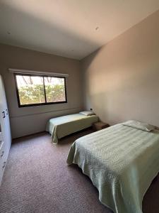 En eller flere senge i et værelse på House with a private pool in Bosque Norte + 19 billeder