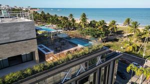 an aerial view of a building and the beach at 2 quartos a beira-mar do Cabo Branco AH103 Fortune in Tambaú