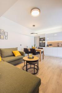a living room with a couch and a table at Marizaf house in Émbonas