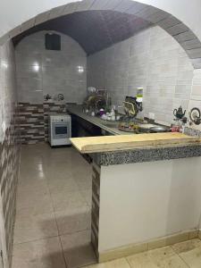 a kitchen with a counter top in a room at منزل نوبي إضافة in Aswan